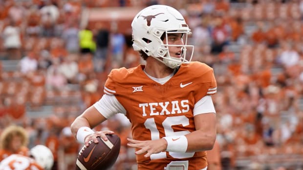 Texas Longhorns quarterback Arch Manning (16) warms up before a game against the Wyoming Cowboys at Darrell K Royal-Texas Memorial Stadium. 